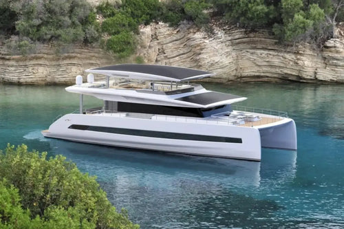 Modern Silent 80 Series Electric Boat on a body of water with cliffs and greenery in the background