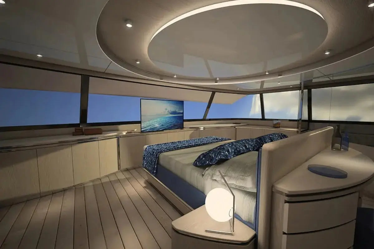 Modern Silent 80 Series Electric Boat interior with bed, television, and large windows.