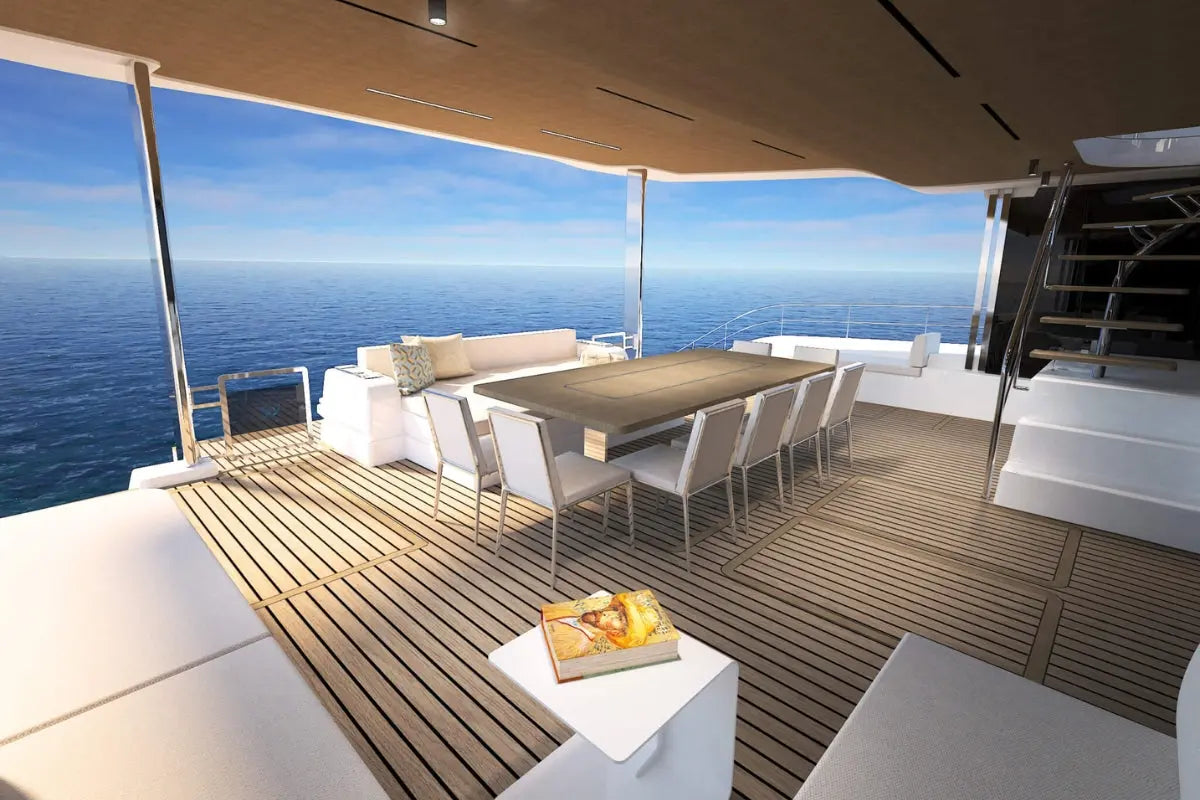 Silent 80 Series Electric Boat deck with dining table and chairs overlooking the ocean