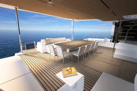 Silent 80 Series Electric Boat deck with dining table and chairs overlooking the ocean