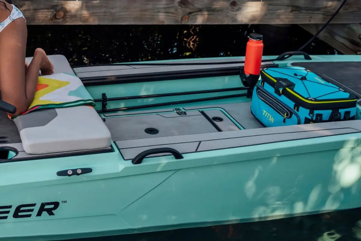 Close-up of Veer V13 Electric Boat with a person sitting inside, surrounded by fishing gear.