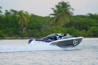 Vision H2e Bowrider Electric Boat on water with trees in the background