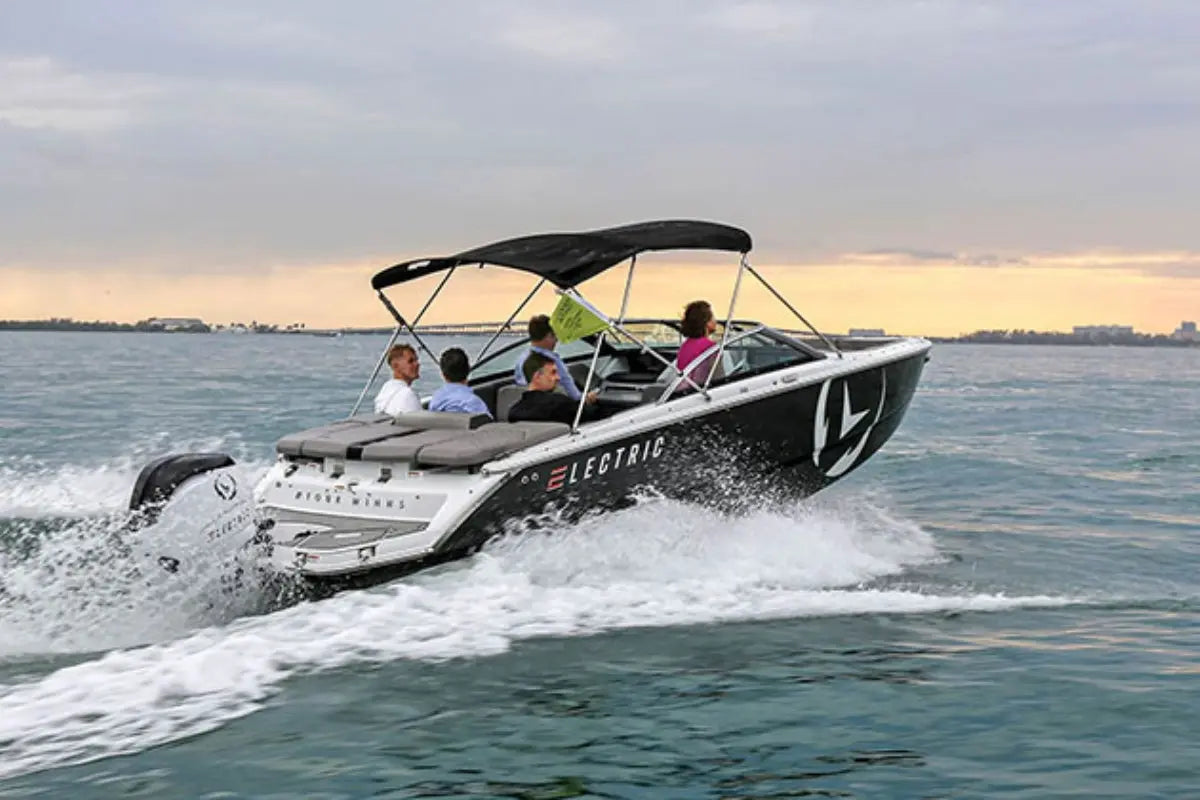 Vision H2e Bowrider Electric Boat with passengers on a body of water