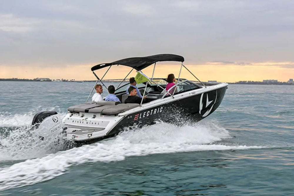 Vision H2e Bowrider Electric Boat with passengers on a body of water