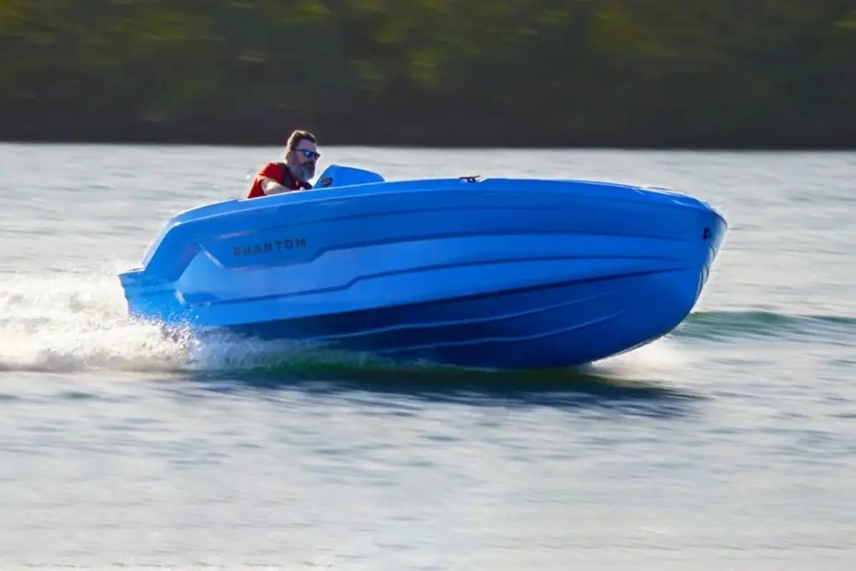 Blue Vision Phantom Electric Boat on a body of water with a person inside