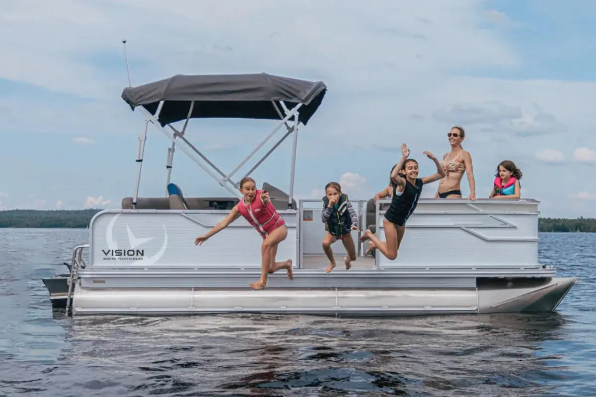 People jumping off Vision V17 Electric Boat on a lake