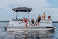 People jumping off Vision V17 Electric Boat on a lake