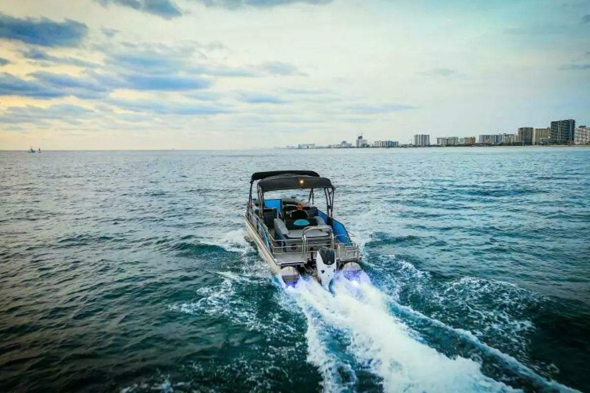 Vision V30 Electric Boat on the water with a city skyline in the background