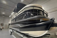 Vision WR Tritoon Electric Boat on a trailer inside a warehouse