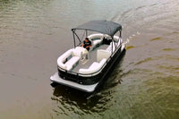 Vision WR Tritoon Electric Boat with a canopy on a body of water