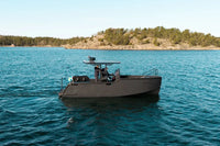 X Shore Pro Electric Boat on a body of water with a scenic background
